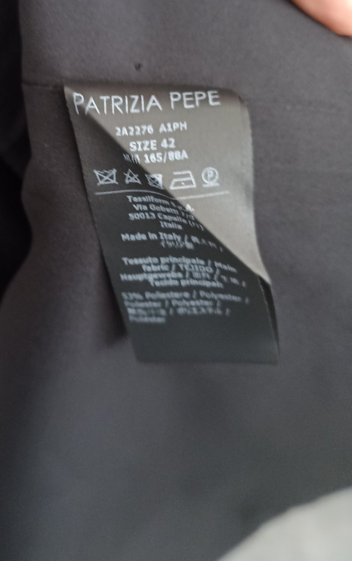 Inside care label of the Patrizia Pepe dress showing size 42 and care symbols.