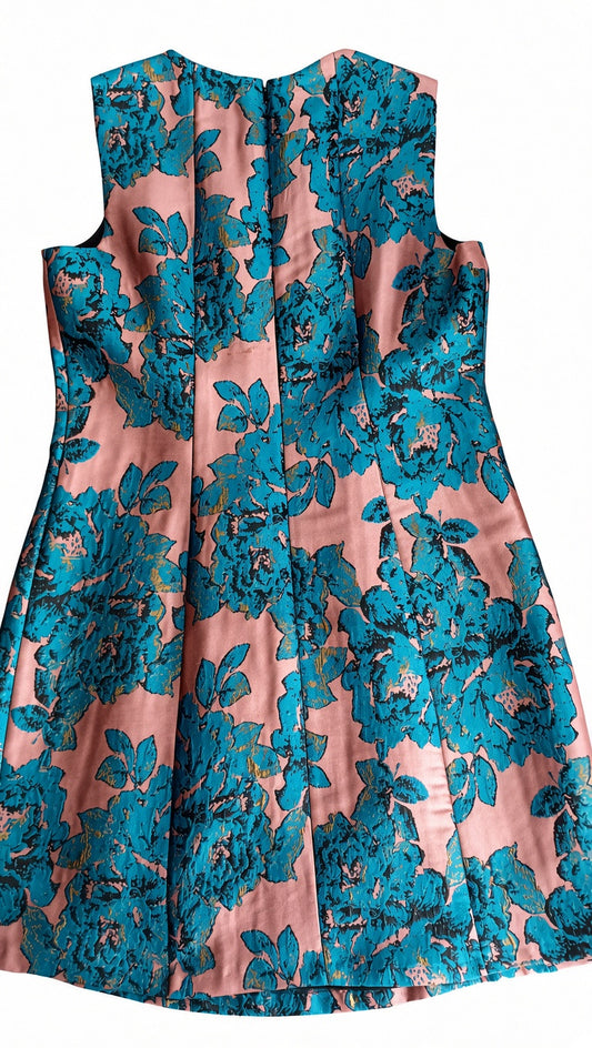 Back of the Monsoon dusty pink and teal floral dress, showing the centre-back zip and flared skirt.