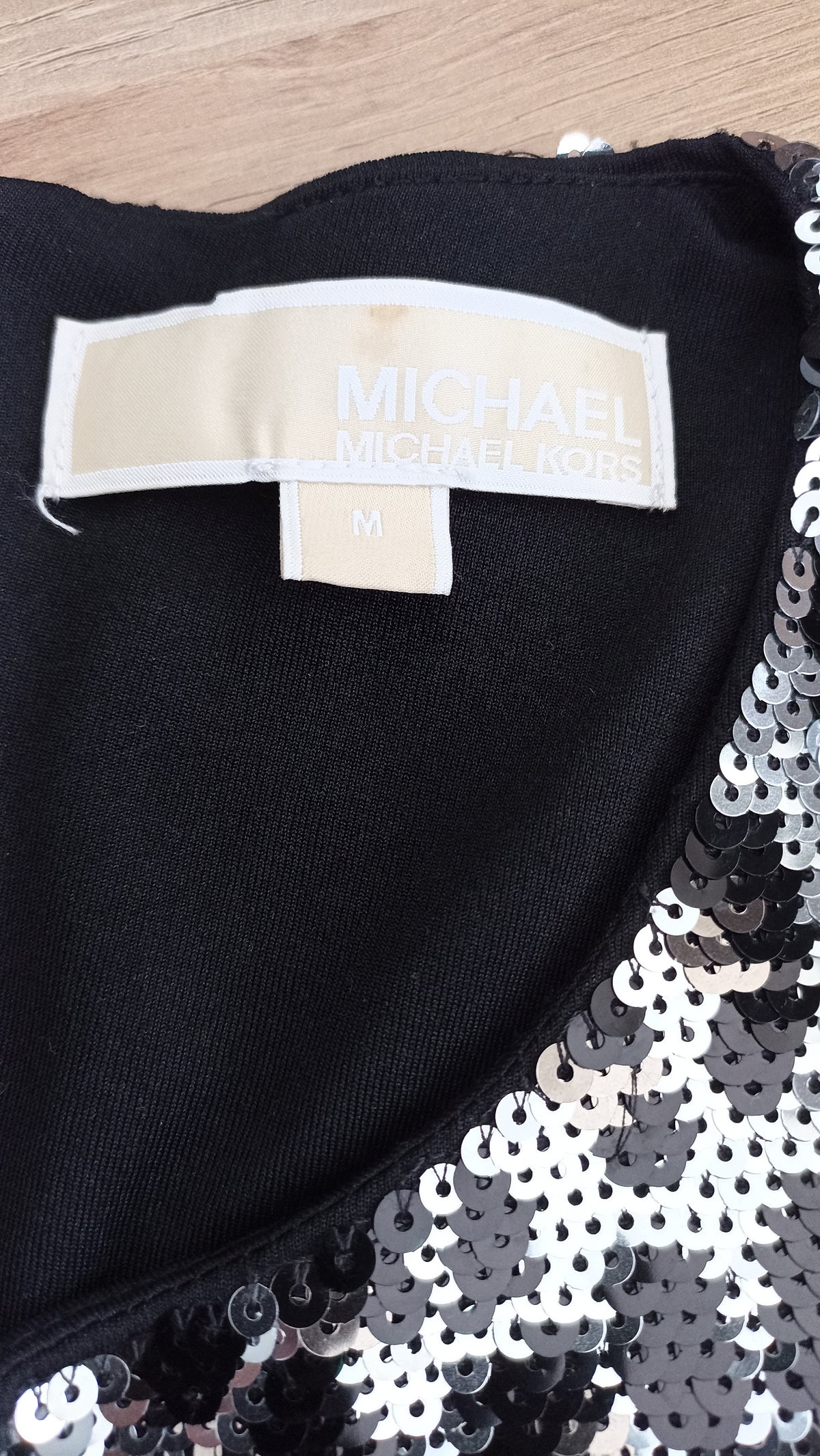 MICHAEL Michael Kors brand label and size M tag inside the sequined top.