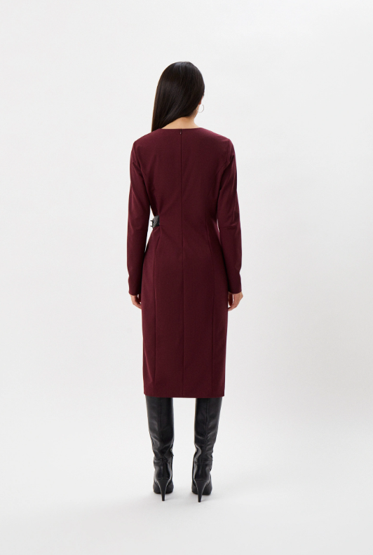 Back view of the burgundy Patrizia Pepe long-sleeved sheath dress worn with black knee-high boots.